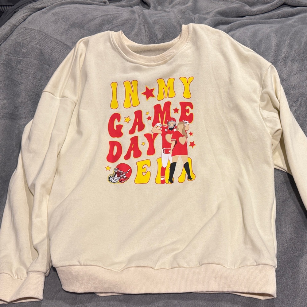 In my Game day Era Sweatshirt with Red and Yellow Print. Never worn